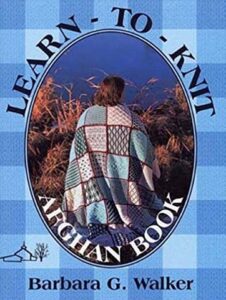 Cover of Learn-To-Knit Afghan Book by Barbara G. Walker. Blue gingham background with photo of a woman wearing the blanket like a shawl.